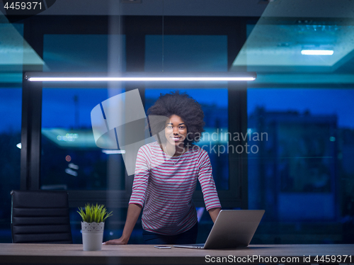 Image of black businesswoman using a laptop in startup office