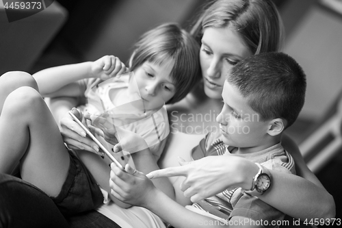 Image of Young Family Using A Tablet To Make Future Plans