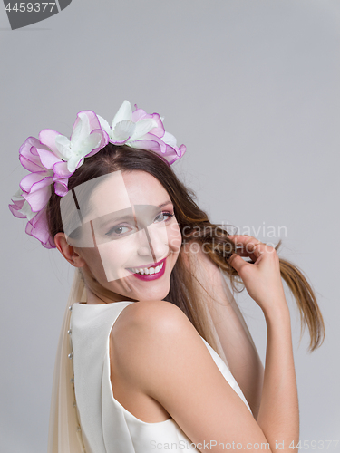 Image of young bride in a wedding dress with a veil