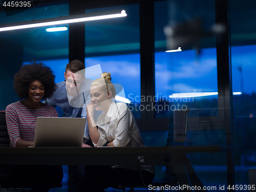 Image of Multiethnic startup business team in night office