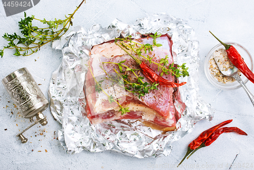 Image of raw meat in foil