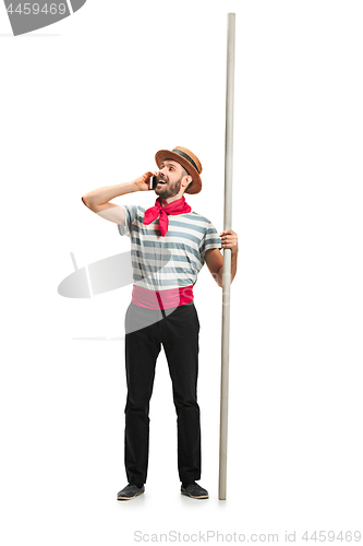 Image of Caucasian man in traditional gondolier costume and hat