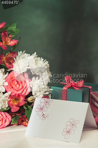 Image of Love background with pink roses, flowers, gift on table