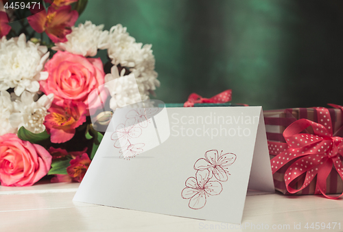 Image of Love background with pink roses, flowers, gift on table