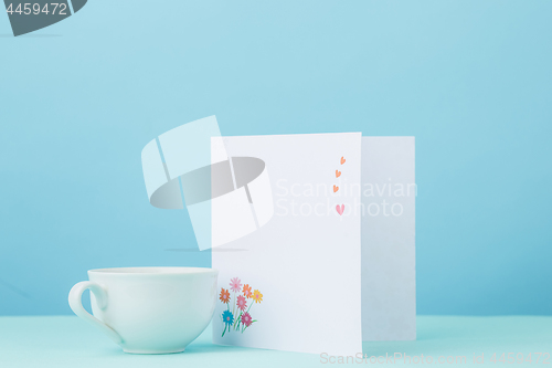 Image of Love background with card and cup gift on table