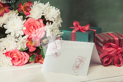 Image of Love background with pink roses, flowers, gift on table