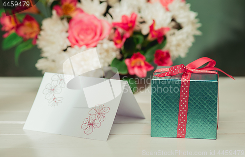 Image of Love background with pink roses, flowers, gift on table