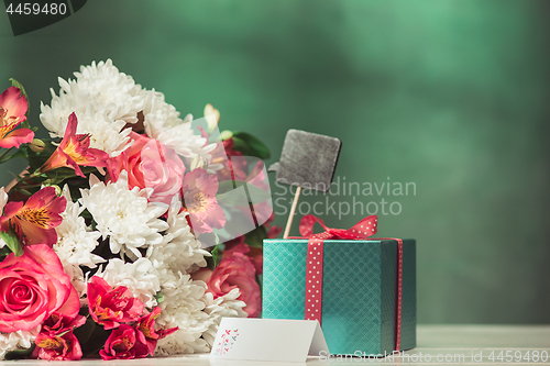 Image of Love background with pink roses, flowers, gift on table