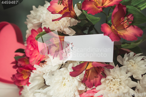 Image of Love background with pink roses, flowers, gift on table