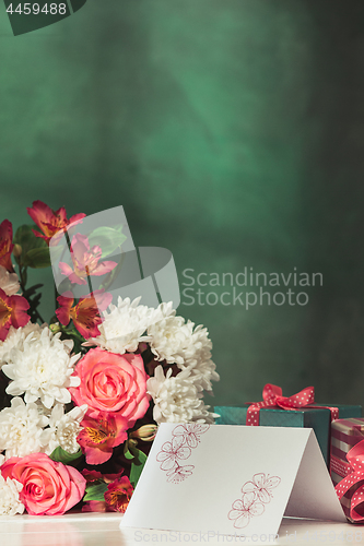 Image of Love background with pink roses, flowers, gift on table