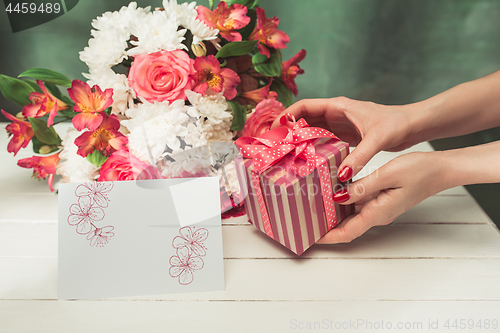 Image of Love background with pink roses, flowers, gift on table