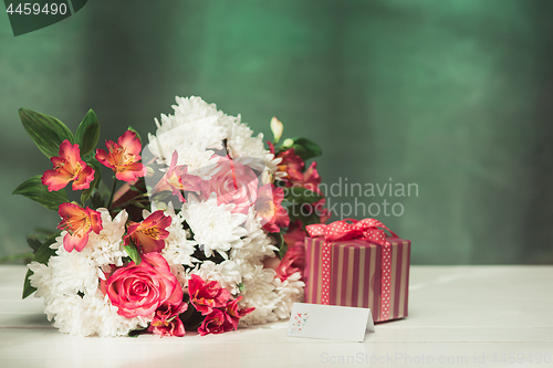 Image of Love background with pink roses, flowers, gift on table