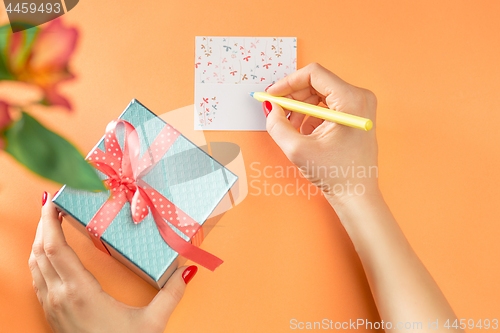 Image of Love background with pink roses, flowers, gift on table