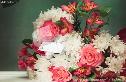 Image of Love background with pink roses, flowers, gift on table