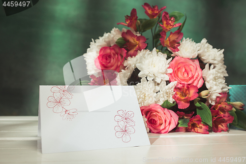 Image of Love background with pink roses, flowers, gift on table