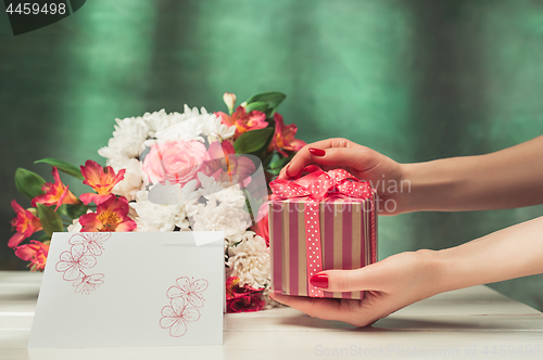 Image of Love background with pink roses, flowers, gift on table