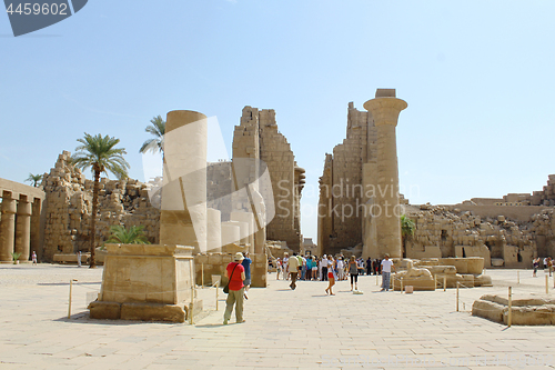 Image of Tourists among the ancient ruins of Karnak Temple in Luxor, Egyp