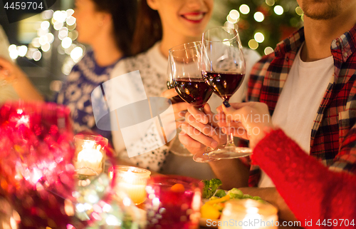 Image of close up of friends with wine celebrate christmas