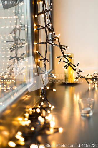 Image of close up of christmas garland on window sill