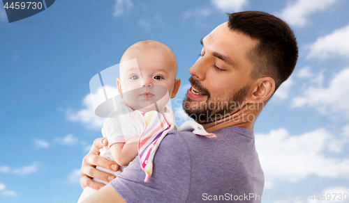 Image of father with little baby girl at home