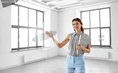 Image of businesswoman or realtor with folder at office