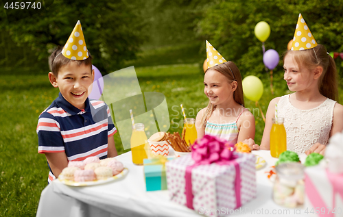 Image of happy kids on birthday party at summer garden