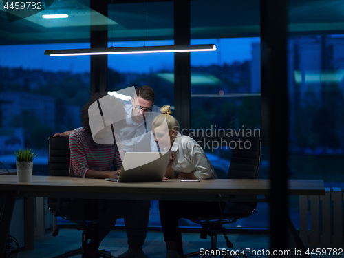 Image of Multiethnic startup business team in night office