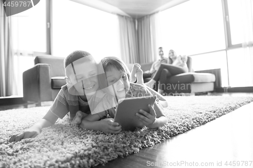 Image of couple spending time with kids