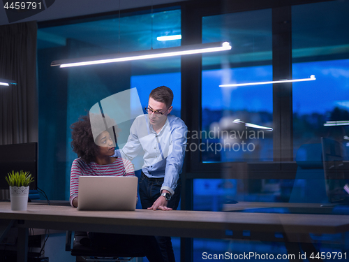 Image of Multiethnic startup business team in night office