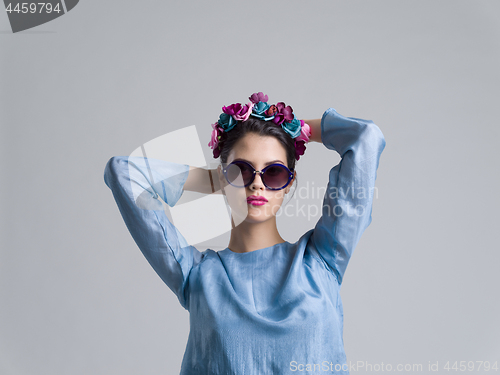 Image of woman posing in fashionable clothes and sunglasses