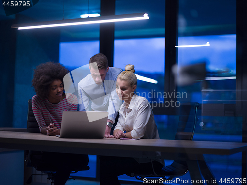 Image of Multiethnic startup business team in night office