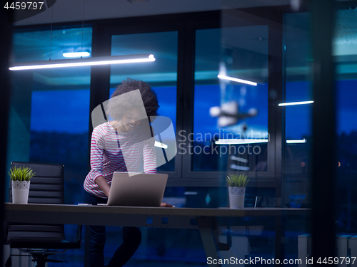 Image of black businesswoman using a laptop in startup office