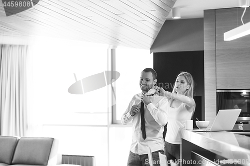 Image of A young couple is preparing for a job and using a laptop