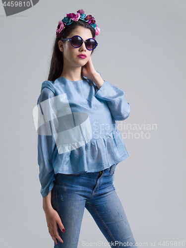 Image of woman posing in fashionable clothes and sunglasses