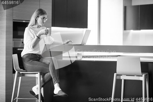 Image of woman drinking coffee enjoying relaxing lifestyle