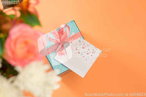 Image of Love background with pink roses, flowers, gift on table