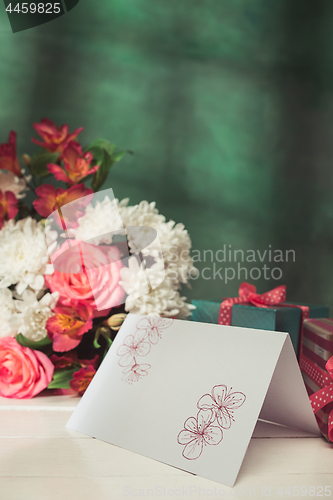 Image of Love background with pink roses, flowers, gift on table