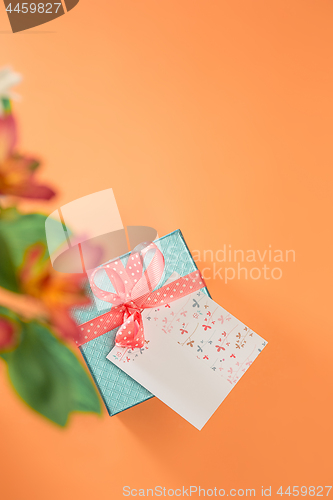 Image of Love background with pink roses, flowers, gift on table