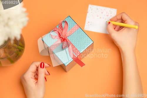 Image of Love background with pink roses, flowers, gift on table