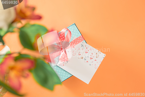Image of Love background with pink roses, flowers, gift on table
