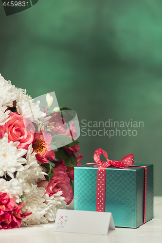 Image of Love background with pink roses, flowers, gift on table