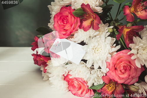 Image of Love background with pink roses, flowers, gift on table