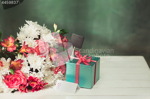 Image of Love background with pink roses, flowers, gift on table