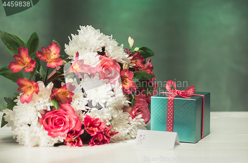 Image of Love background with pink roses, flowers, gift on table