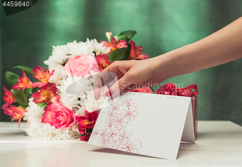Image of Love background with pink roses, flowers, gift on table