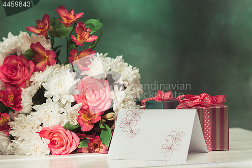 Image of Love background with pink roses, flowers, gift on table