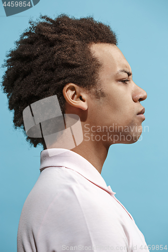 Image of Beautiful bored afro man isolated on blue background