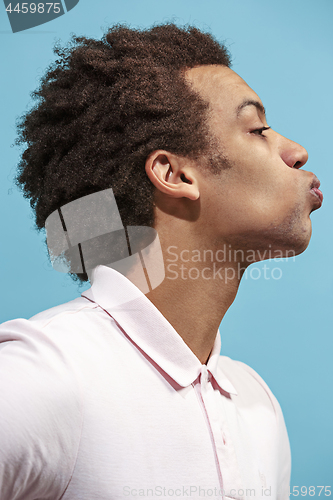 Image of Portrait of attractive afro man with kiss isolated over blue background