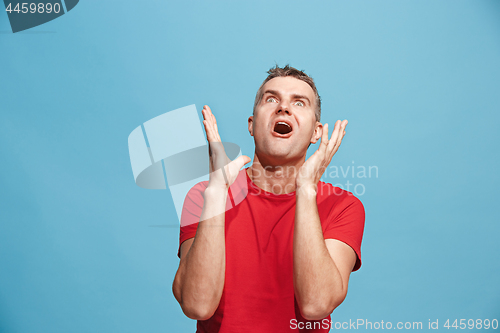 Image of Winning success man happy ecstatic celebrating being a winner. Dynamic energetic image of male model