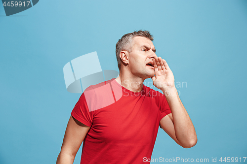 Image of Isolated on pink young casual man shouting at studio